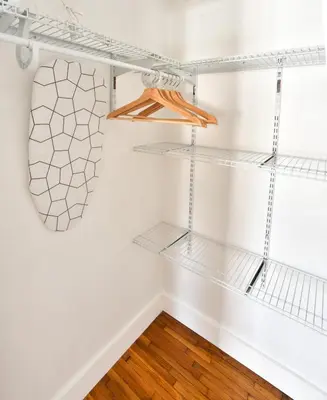 a room with white walls and white shelves at Broadwaysuites Downtown By RocketStay in Miami