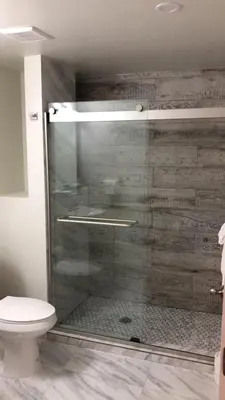 a bathroom with a glass shower with a toilet at The Drift Hotel in Fort Lauderdale