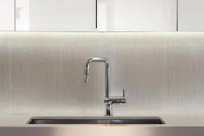 a kitchen sink with a chrome kitchen faucet at Oceanfront Private Condo at 1 Hotel & Homes -1219 in Miami Beach
