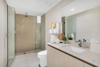 a bathroom with a toilet and a sink and a shower at Luxury 3 Br- Front Intercostal View - Amazing Pools in Hollywood
