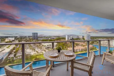 a balcony with a table and chairs and a view of the city at Luxury 1Br-Front Intracoastal View Balcony - Pools in Hollywood