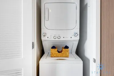 a white washer and dryer in a room at Luxury 1Br-Front Intracoastal View Balcony - Pools in Hollywood