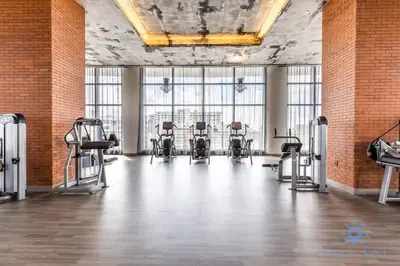 a gym with a row of chairs in a room with windows at Luxury 1Br-Front Intracoastal View Balcony - Pools in Hollywood