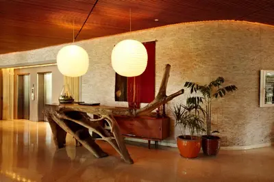 a room with a wooden table and a mirror at The Standard Spa, Miami Beach in Miami Beach