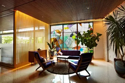 a living room with a couch and a stained glass window at The Standard Spa, Miami Beach in Miami Beach