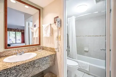 a bathroom with a sink and a toilet and a shower at Hotolos Hollywood in Hollywood