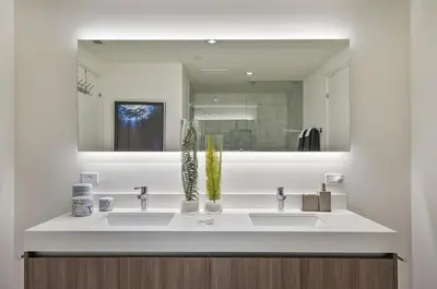 a bathroom with two sinks and a mirror at 914 Tiffany House condo in Fort Lauderdale