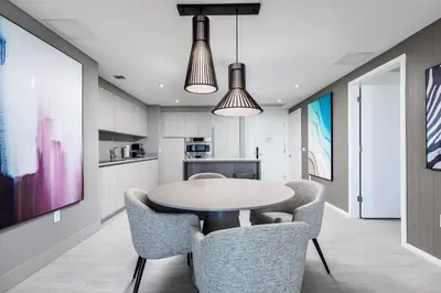 a kitchen and dining room with a table and chairs at Hyde Beach House Hollywood Private Suites in Hollywood