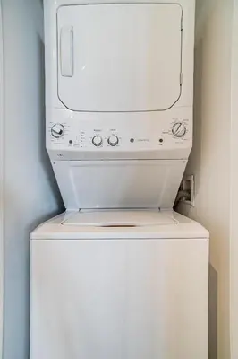a microwave sitting on top of a washing machine at Relaxing Getaway with Intracoastal Views in Hollywood