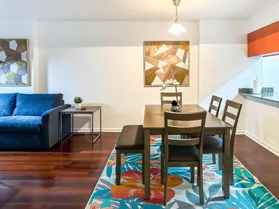 a living room with a table and chairs and a couch at Star Stay Miami Yellow Brickell in Miami