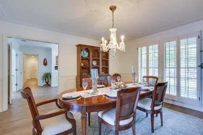 a dining room with a table and chairs and a chandelier at Waterfront Fort Lauderdale House with Heated Pool! in Fort Lauderdale