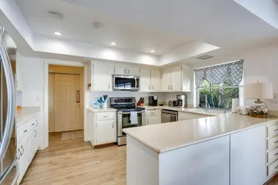 a kitchen with white cabinets and a counter top at Waterfront Fort Lauderdale House with Heated Pool! in Fort Lauderdale