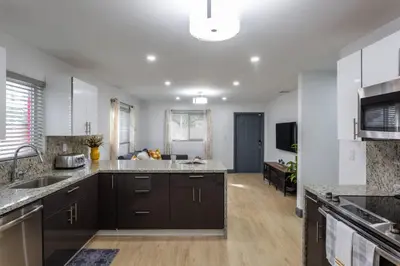 a kitchen with a sink and a counter top at Casa Madeira @ the heart of Miami Design District in Miami