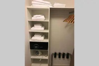 a closet with white towels on a shelf at Hollywood Beach luxury condo-HBH in Hollywood