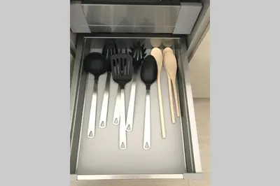 a drawer full of spatulas andoons in a kitchen at Hollywood Beach luxury condo-HBH in Hollywood