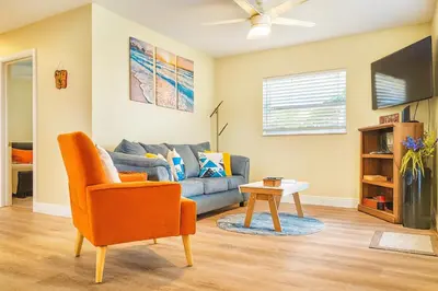 a living room with a couch and a table at Family, Couples Retreat near Airport, Cruise Port & Beaches in Fort Lauderdale