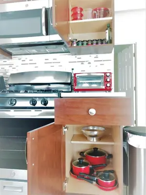 a kitchen with a stove and some pots and pans at Family, Couples Retreat near Airport, Cruise Port & Beaches in Fort Lauderdale