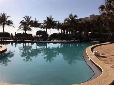 a large swimming pool with palm trees in a resort at THE TIDES on MIAMI HOLLYWOOD in Hollywood