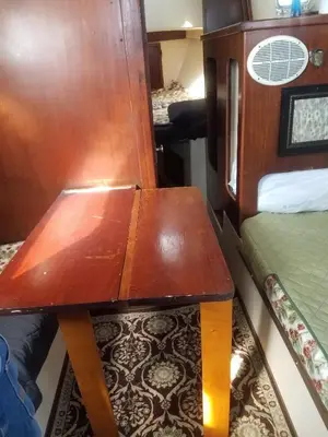 a wooden table in a room with a bed at Unique perspective in Miami