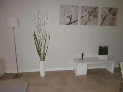 a living room with a white table and a plant at Miami HOLLYWOOD in Hollywood