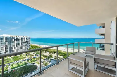 a balcony with a view of the beach and ocean at Oceanview Private Condo at The Setai -2401 in Miami Beach