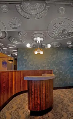 a lobby with a bar in the middle of a room at Hotel Maren Fort Lauderdale Beach, Curio Collection By Hilton in Fort Lauderdale