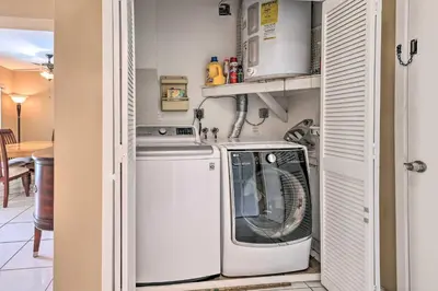 a laundry room with a washer and dryer at Home with Pool in Upscale Pinecrest Village in Miami