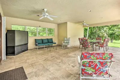 a living room with a couch and a table and chairs at Home with Pool in Upscale Pinecrest Village in Miami