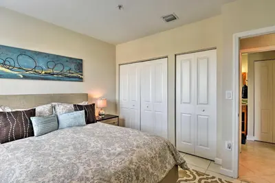 a bedroom with a bed and a painting on the wall at Miami Apartment by Coral Gables - Great Location! in Miami