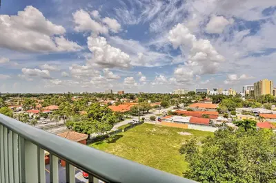 a view of a city from a balcony at Miami Apartment by Coral Gables - Great Location! in Miami
