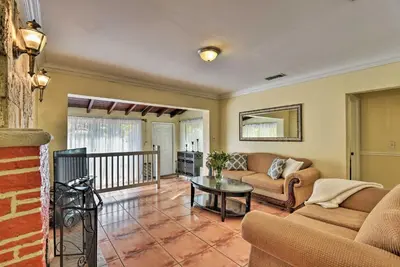 a living room with a couch and a table at Quaint Central Miami Bungalow 10 Mi to Mid-Beach! in Miami