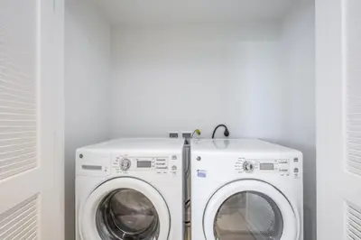 a washer and dryer in a white laundry room at Hyde Beach House Luxury Condo-Resort 2808 condo in Hollywood Beach
