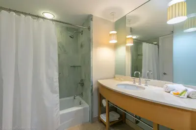 a bathroom with a sink and a shower and a tub at 2 BR Luxury Suite in Marenas Beach Resort 2508 condo in Miami Beach