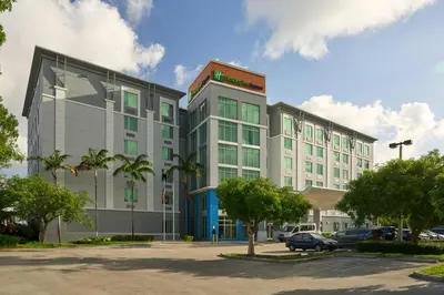 a rendering of a building in a parking lot at Holiday Inn Express Miami Airport-Blue Lagoon Area by IHG in Miami