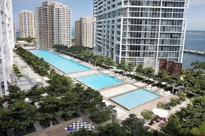 an aerial view of two pools in a city with buildings at ICON BRICKELL-29th FLOOR OCEAN VIEWS-FREE SPA in Miami