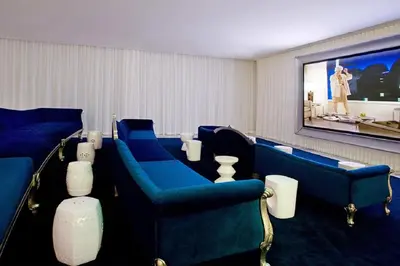 a waiting room with blue chairs and a flat screen tv at ICON BRICKELL-29th FLOOR OCEAN VIEWS-FREE SPA in Miami