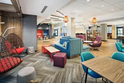 a lobby with colorful furniture and tables and chairs at Tru By Hilton Ft Lauderdale Airport in Dania Beach