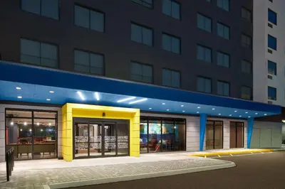 a building with a yellow and blue facade at Tru By Hilton Ft Lauderdale Airport in Dania Beach