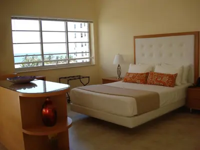a bedroom with a large bed and a window at Westover Arms Hotel in Miami Beach