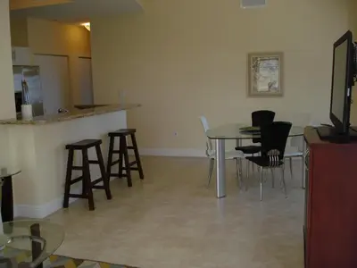 a living room with a table and chairs at Westover Arms Hotel in Miami Beach