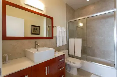 a bathroom with a sink and a toilet and a shower at Westover Arms Hotel in Miami Beach
