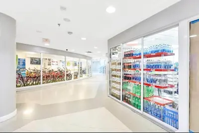 an empty aisle of a store with bikes at Castle 1733 Ocean view studio with direct beach access, pool, tennis & free parking in Miami Beach