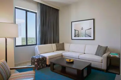 a living room with a couch and a coffee table at THesis Hotel Miami Coral Gables, Curio Collection by Hilton in Miami