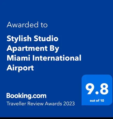 a blue sign that says upgraded to sykrit studio agreement by main international airport at Stylish Studio Apartment By Miami International Airport in Miami