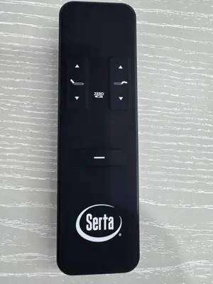 a black serta remote control sitting on a table at Stylish Studio Apartment By Miami International Airport in Miami
