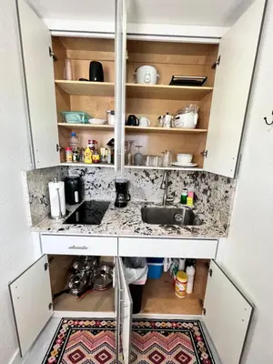 a kitchen with a sink and a counter at Stylish Studio Apartment By Miami International Airport in Miami