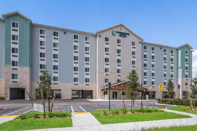 a rendering of a hotel with a parking lot at WoodSpring Suites Doral Miami Airport in Miami