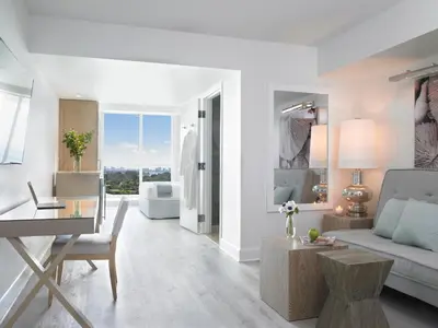 a living room with a couch and a table at Grand Beach Hotel Surfside in Miami Beach