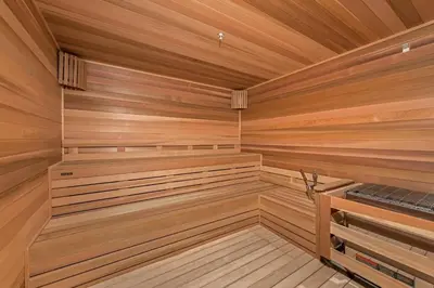 a sauna with wooden walls and wooden flooring at Provident Grand Luxury Short-Term Residences in Miami