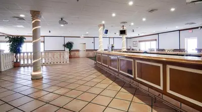 a large room with a bar in a building at Miami Gardens Inn & Suites in Miami